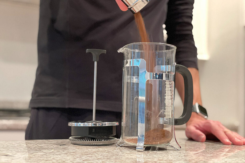 Adding coffee grounds to French Press